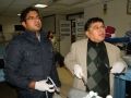 Doctors Performing Laparoscopic small bowel resection and anastomosis using totally intracorporeal surgeons knot.
