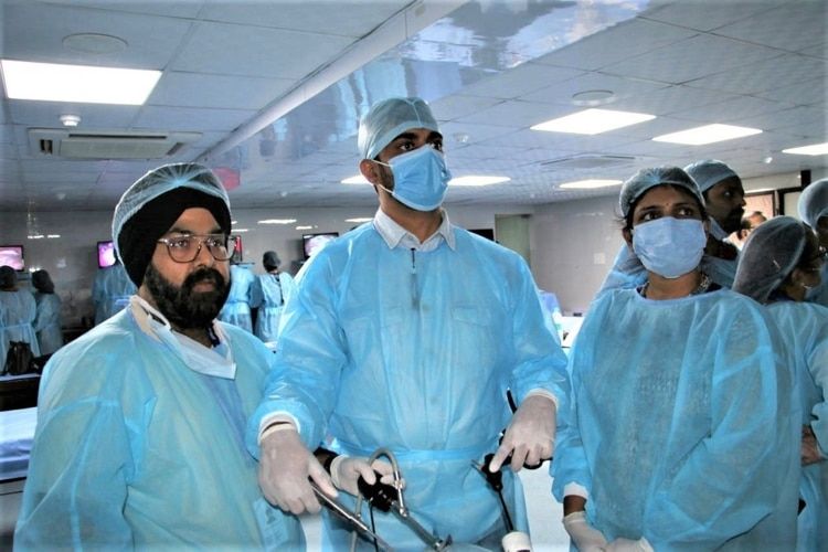 Surgeons and gynecologist practicing Laparoscopic intracorporeal Tumble Square Knot Demonstration By Prof Dr. R. K. Mishra