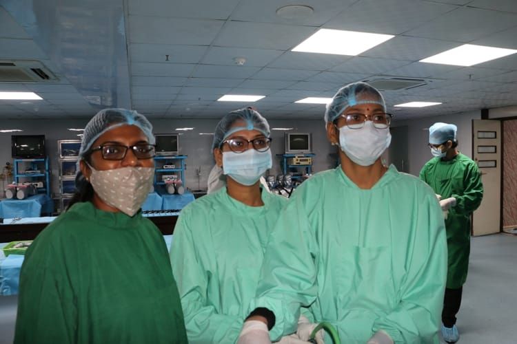 Gynecologist Inter active Laparoscopic wet lab practicing Laparoscopic Tubal Sterilization, Salpingostomy, Ovarian Drilling and Hysterectomy surgery on the Live Tissue Demonstration by Dr. B. S. Balla.