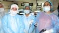 Gynecologist practicing Laparoscopic Tubal Sterilization, Salpingostomy, Ovarian Drilling and Hysterectmy surgery on the Live Tissue Demonstration by Dr. J. S. Chowhan.