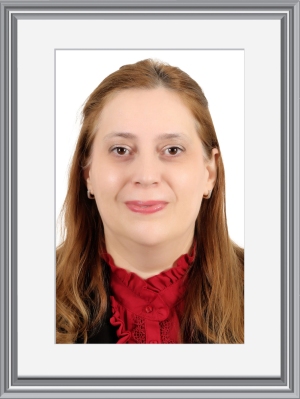 Dr. NORA SHARAFLI