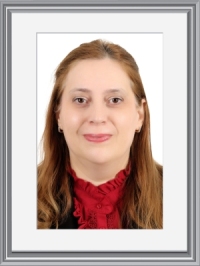 Dr. NORA SHARAFLI